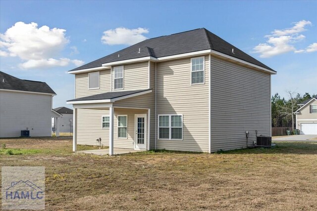 7 Summerhill Dr, Ludowici, GA 31316 - rear view of property featuring a lawn, a patio area, and cooling unit