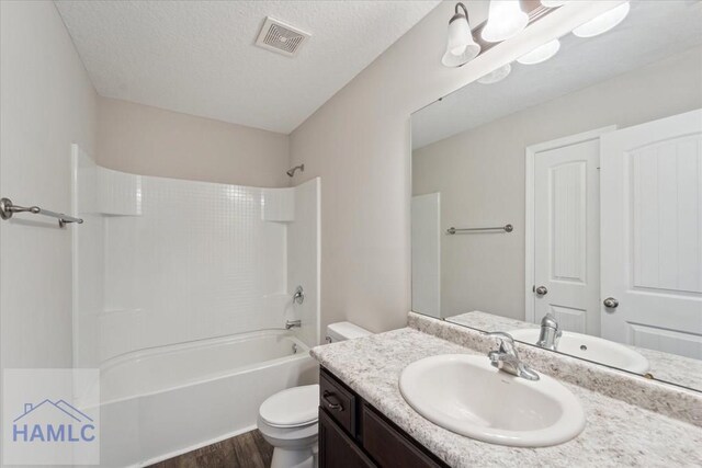 7 Summerhill Dr, Ludowici, GA 31316 - bathroom with shower / tub combination, vanity, toilet, wood finished floors, and visible vents