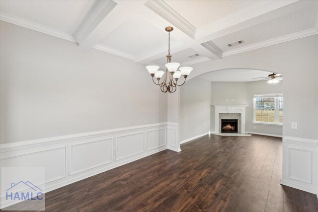 7 Summerhill Dr, Ludowici, GA 31316 - unfurnished living room featuring visible vents, beamed ceiling, dark wood finished floors, and ceiling fan with notable chandelier
