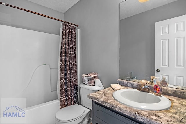 full bathroom with toilet, vanity, shower / tub combo with curtain, and a textured ceiling