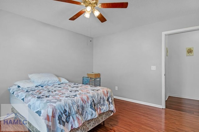 bedroom featuring ceiling fan and hardwood / wood-style floors