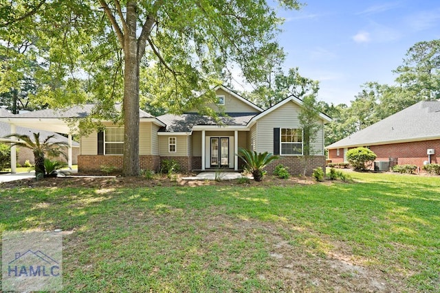 78 Heron View Ct, Richmond Hill, GA 31324 - view of front of house featuring brick siding, a front lawn, and cooling unit