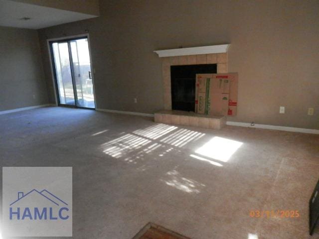 625 Oak St, Hinesville, GA 31313 - unfurnished living room featuring a tile fireplace and baseboards