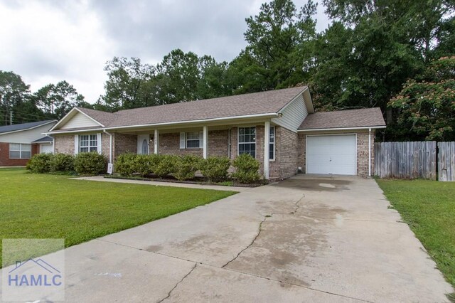 1048 Barley Dr, Hinesville, GA 31313 - single story home with an attached garage, brick siding, driveway, and a shingled roof