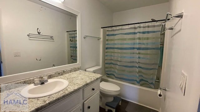 bathroom with vanity, toilet, and shower / bath combo with shower curtain