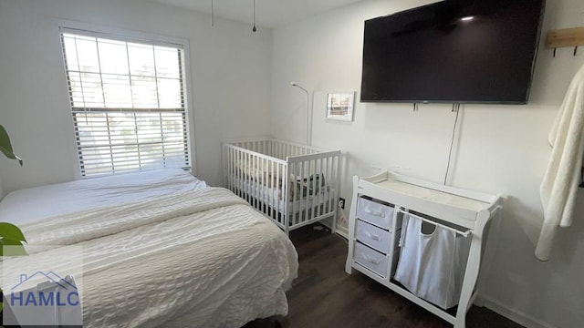 bedroom featuring dark wood-type flooring