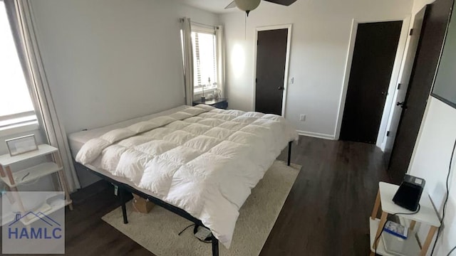 bedroom featuring dark wood-style flooring