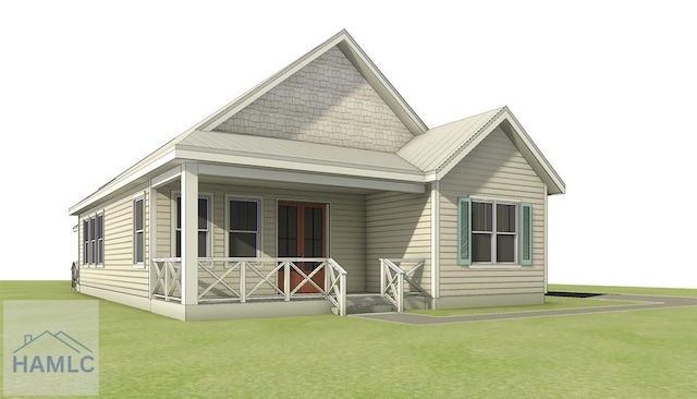 rear view of property with a yard