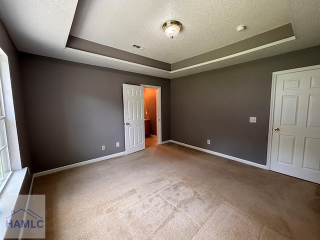 193 River Bend Dr, Midway, GA 31320 - carpeted empty room with a tray ceiling, a textured ceiling, and a smoke detector