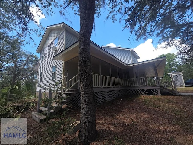 5927 Yellow Bluff Rd, Blackshear, GA 31516 - view of side of home with stairway and covered porch