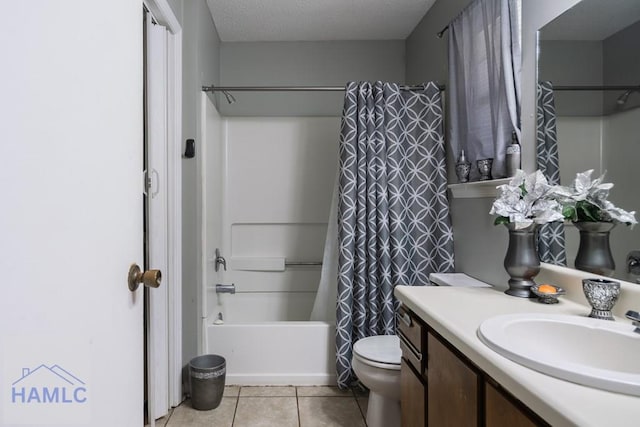 901 Pintail Ct, Hinesville, GA 31313 - bathroom featuring vanity, tile patterned flooring, shower / bath combo, and a textured ceiling