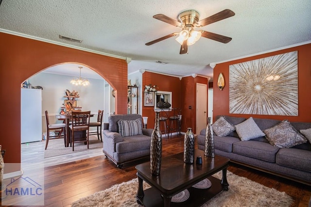 901 Pintail Ct, Hinesville, GA 31313 - living area with crown molding, arched walkways, a ceiling fan, wood finished floors, and a textured ceiling