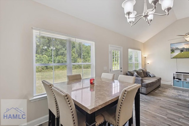260 Linden Dr, Jesup, GA 31545 - dining space with a chandelier, lofted ceiling, healthy amount of natural light, and wood finished floors