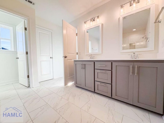 bathroom with vanity and walk in shower