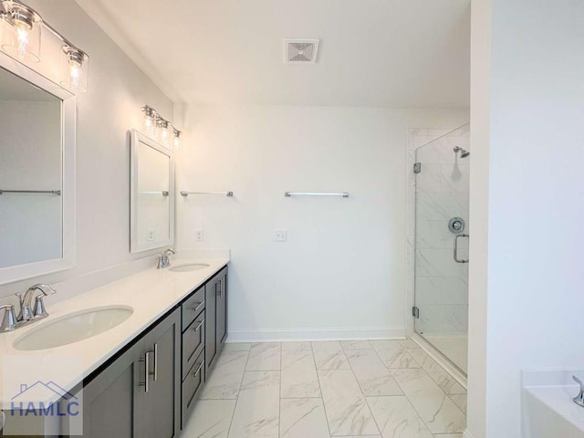 bathroom featuring vanity and an enclosed shower