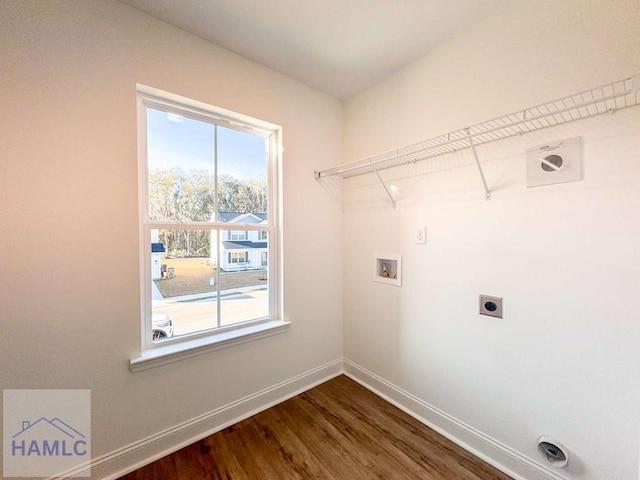 washroom with washer hookup, hardwood / wood-style floors, and electric dryer hookup