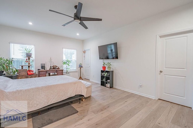bedroom with light wood finished floors, multiple windows, recessed lighting, and baseboards
