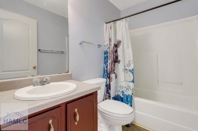 full bathroom featuring vanity, shower / bath combination with curtain, and toilet