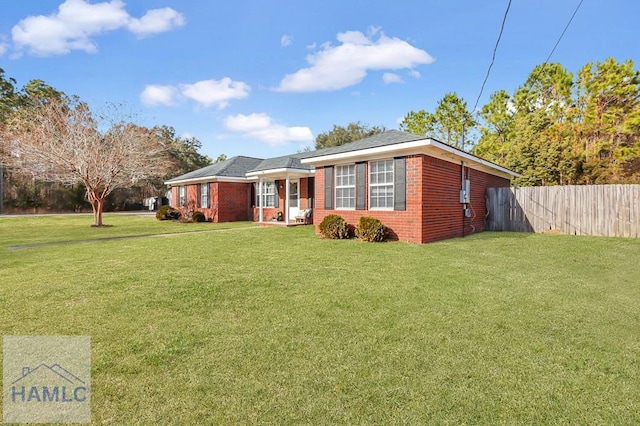 ranch-style house with a front yard