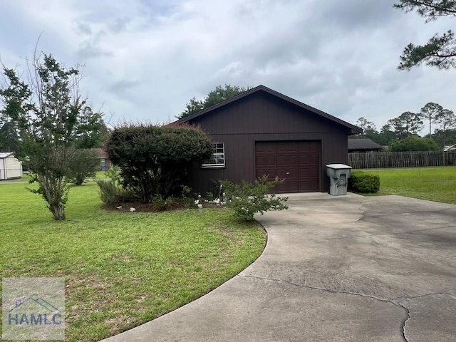 224 Bacon St, Jesup, GA 31545 - view of side of property with a garage and concrete driveway