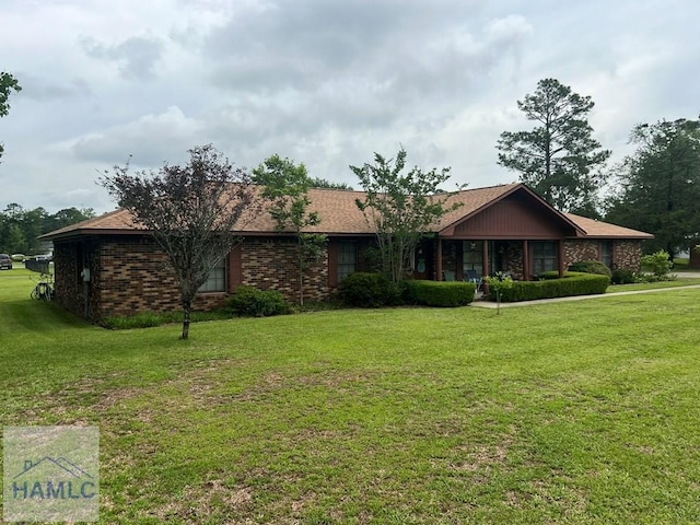 224 Bacon St, Jesup, GA 31545 - single story home with a front lawn and brick siding