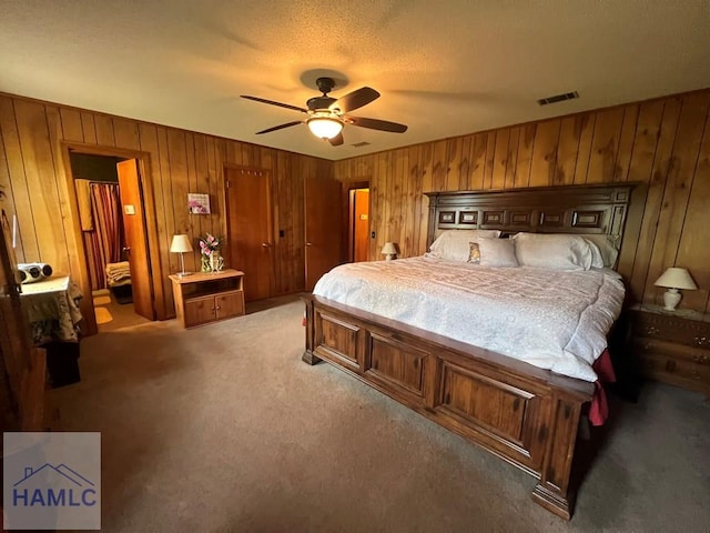224 Bacon St, Jesup, GA 31545 - carpeted bedroom featuring wooden walls and a ceiling fan