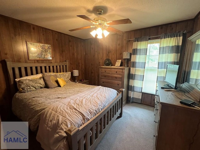 224 Bacon St, Jesup, GA 31545 - bedroom with wooden walls, light colored carpet, a textured ceiling, and ceiling fan