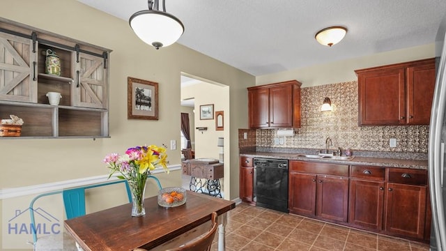 kitchen with dark countertops, dark brown cabinets, backsplash, dishwasher, and a sink