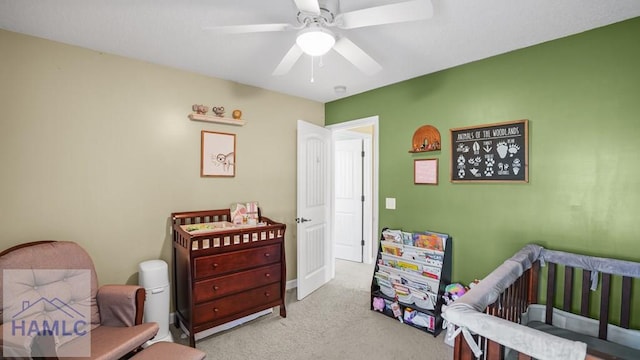 bedroom with a ceiling fan and carpet