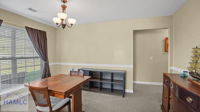 dining space with a chandelier, visible vents, carpet flooring, and baseboards