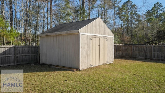 view of shed featuring a fenced backyard