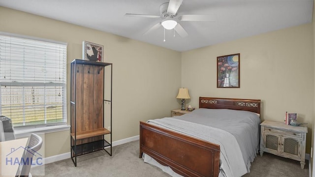 bedroom with ceiling fan, carpet, and baseboards