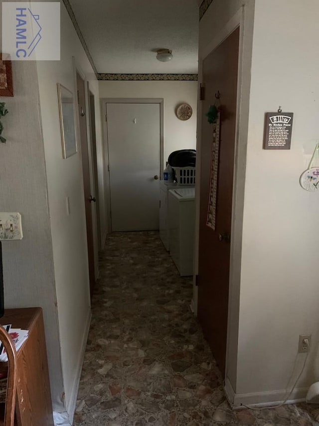 corridor with independent washer and dryer