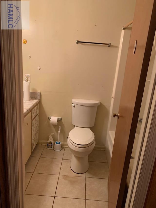 full bathroom with tile patterned floors, vanity, toilet, and independent shower and bath