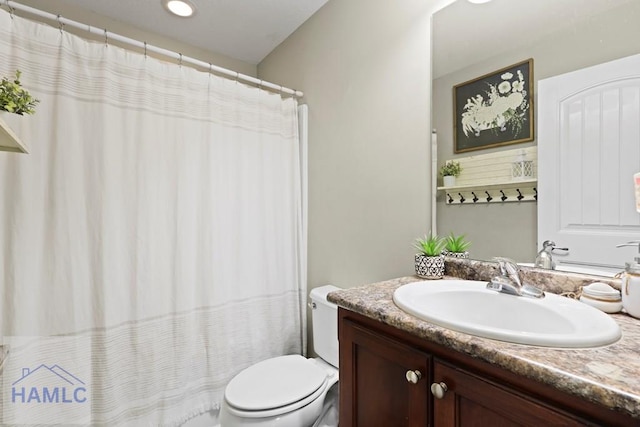 308 Mancey Garrason Loop NE, Ludowici, GA 31316 - bathroom with vanity, toilet, a shower with shower curtain, and recessed lighting