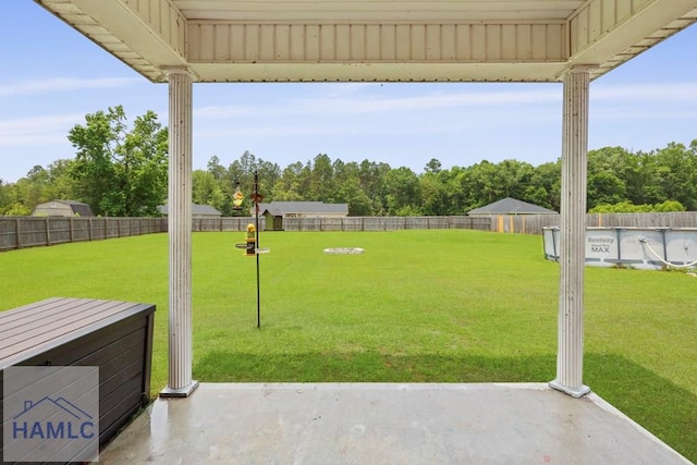 308 Mancey Garrason Loop NE, Ludowici, GA 31316 - view of yard with a patio area