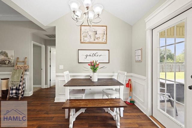 308 Mancey Garrason Loop NE, Ludowici, GA 31316 - dining room with a chandelier, vaulted ceiling, wood finished floors, and wainscoting