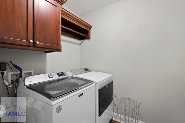 308 Mancey Garrason Loop NE, Ludowici, GA 31316 - laundry room featuring separate washer and dryer and cabinet space