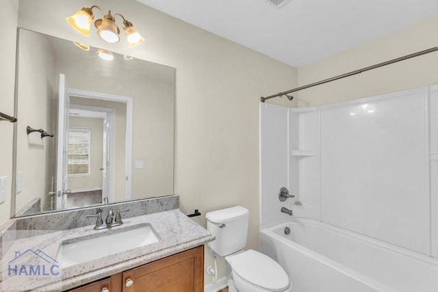 full bathroom featuring vanity, shower / bathtub combination, and toilet