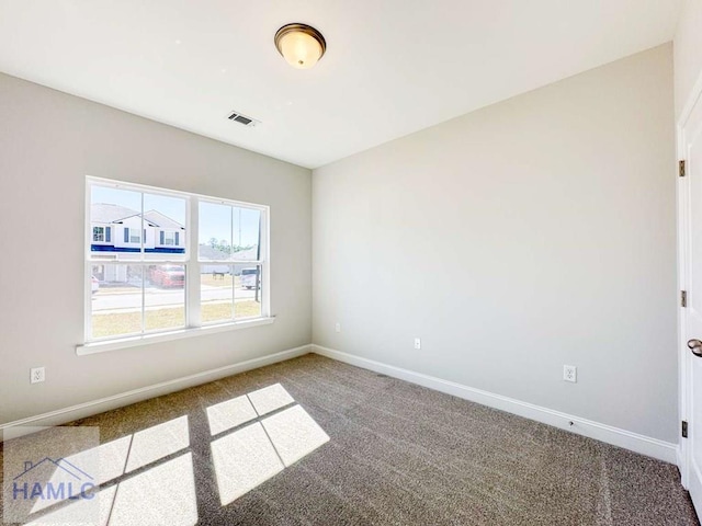 unfurnished room with carpet flooring