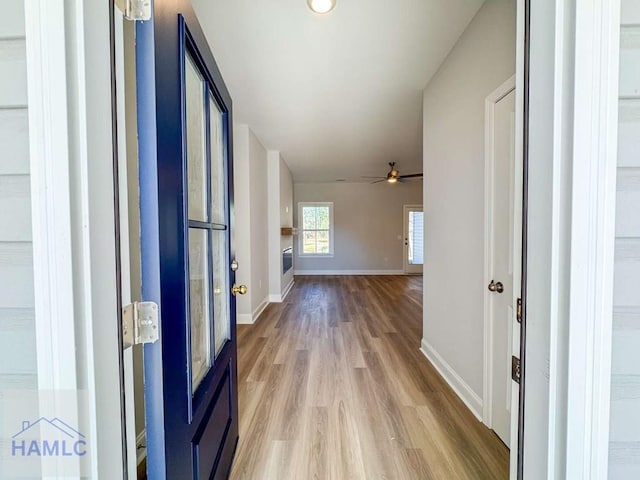 corridor featuring light wood-type flooring