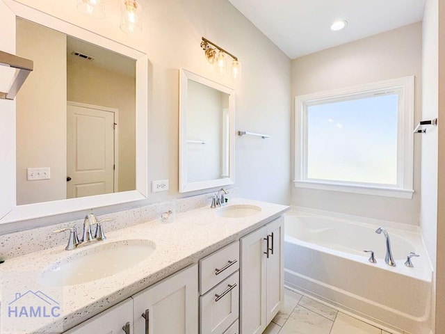 bathroom featuring vanity and a bathtub