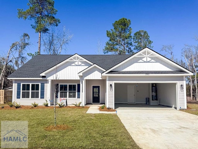 view of front facade featuring a garage and a front lawn