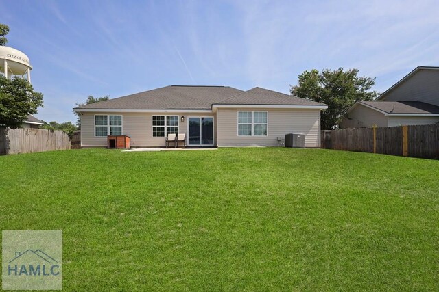 413 E Banks St, Glennville, GA 30427 - back of house featuring central air condition unit and a patio