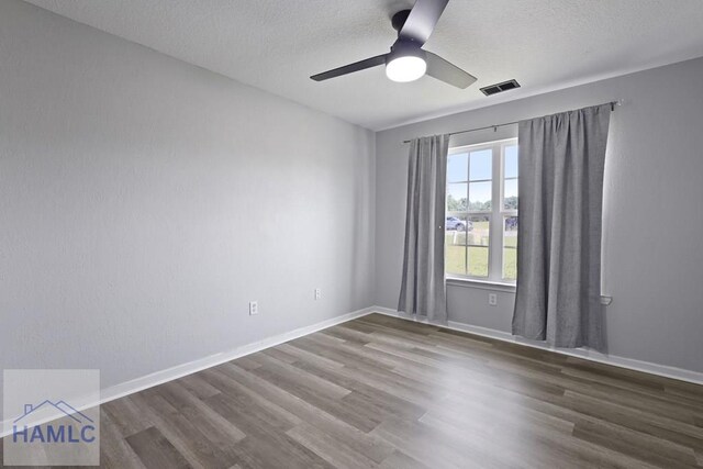 413 E Banks St, Glennville, GA 30427 - spare room featuring wood finished floors, a ceiling fan, baseboards, and a textured ceiling