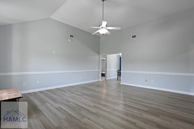 413 E Banks St, Glennville, GA 30427 - unfurnished room featuring vaulted ceiling, ceiling fan, wood finished floors, and baseboards