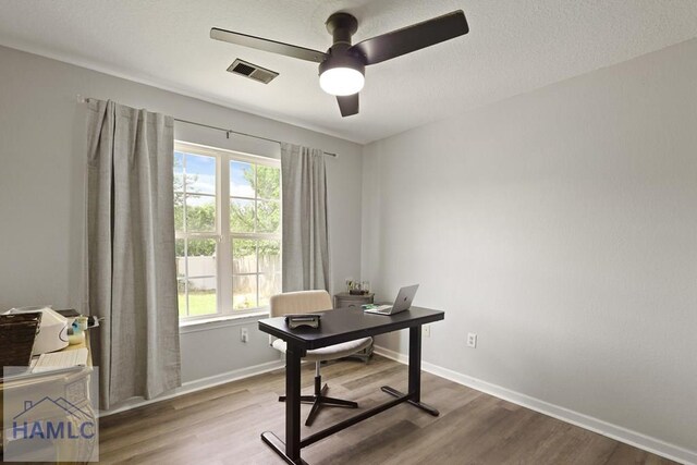 413 E Banks St, Glennville, GA 30427 - office area with wood finished floors, ceiling fan, and baseboards