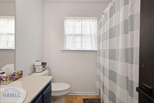 413 E Banks St, Glennville, GA 30427 - full bathroom with toilet, vanity, and a shower with shower curtain