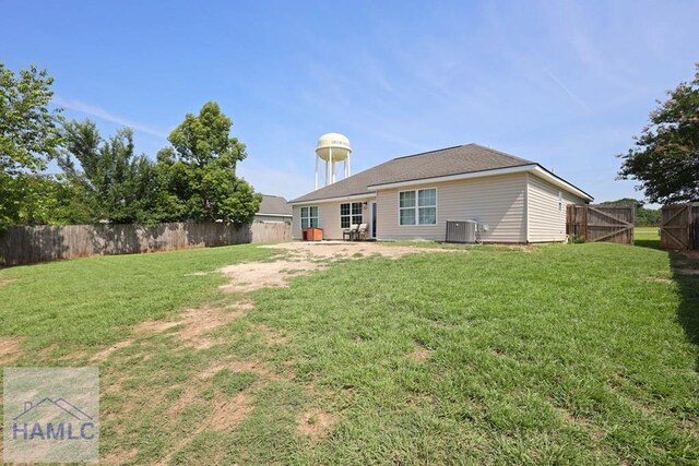413 E Banks St, Glennville, GA 30427 - back of house with central AC and a patio area