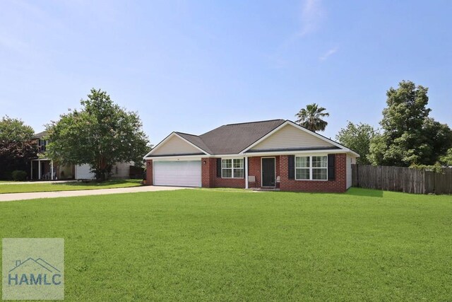 413 E Banks St, Glennville, GA 30427 - single story home with a garage, concrete driveway, and brick siding
